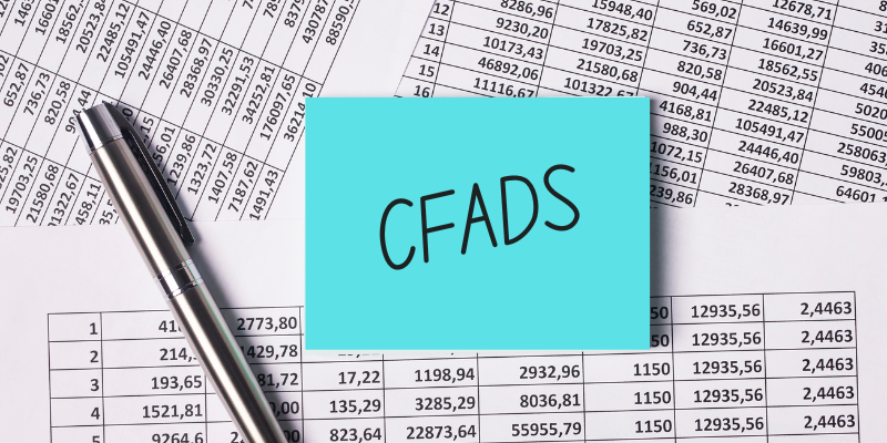 Spreadsheets with sticky note that says CFADS